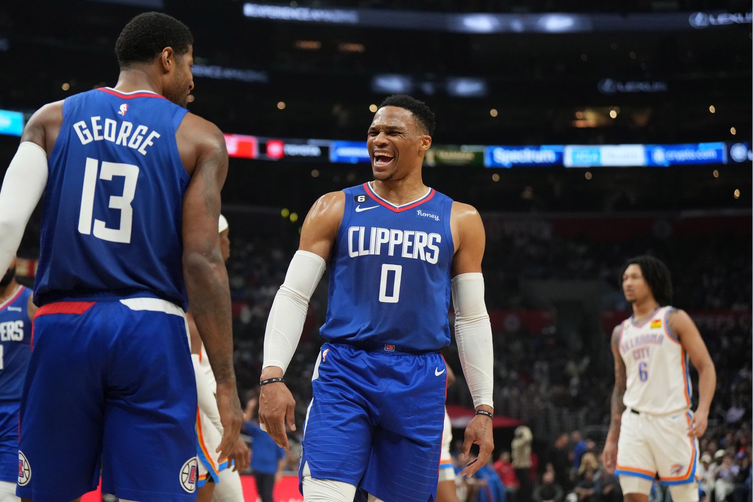 Mar 21, 2023; Los Angeles, California, USA; LA Clippers guard Russell Westbrook (0) and forward Paul George (13) react against the Oklahoma City Thunder in the second half at Crypto.com Arena. Mandatory Credit: Kirby Lee-USA TODAY Sports